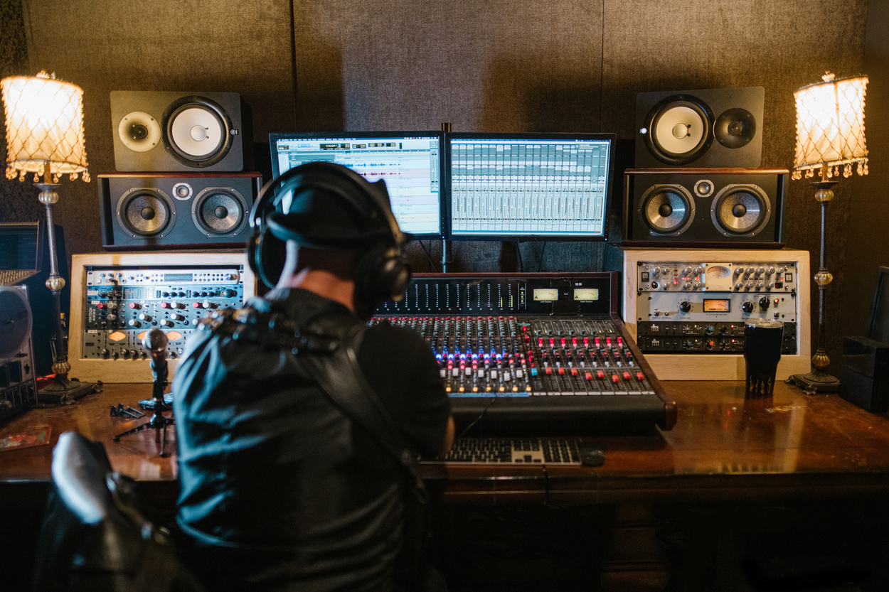 Man in Black Leather Jacket Wearing Black Headphones